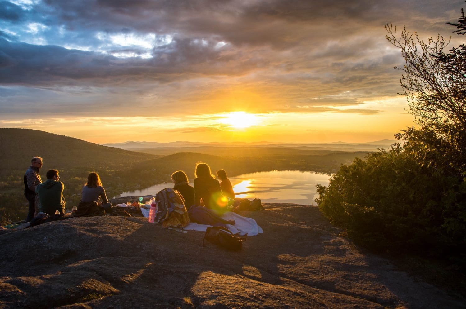 Silhouette of group on mountain at sunset